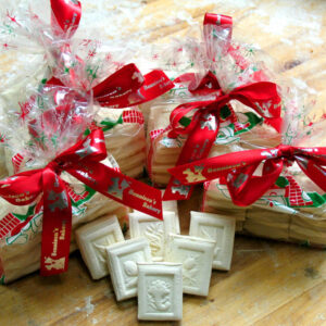 Picture of christmas springerle cookies inside bags and on the table