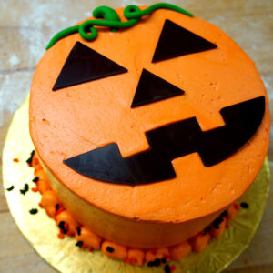 Picture of cake with halloween pumpkin design on top